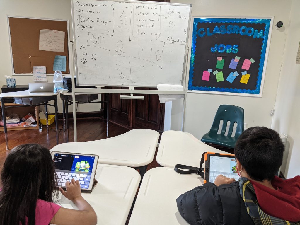 Kids coding on their iPads